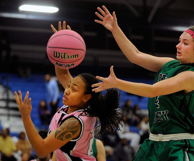 Canyon Springs’ Trimece Thomas, left, and Green Valley’s Brooke Haney vie for a ...