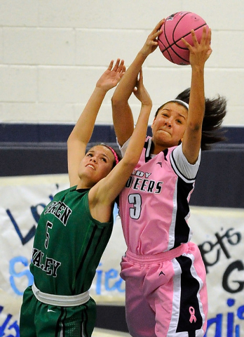 Canyon Springs’ Cherise Beynon (3) grabs a rebound over Green Valley’s Milena Pa ...