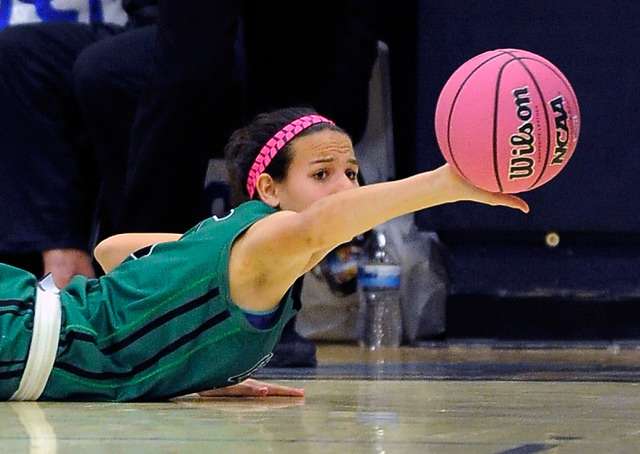 Green Valley’s Milena Palor passes the ball as she lays on the court Monday night agai ...