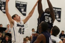 Agassi Prep’s Wa’T Manor (50) shoots over The Meadows’ Brandon Rufty (42) ...