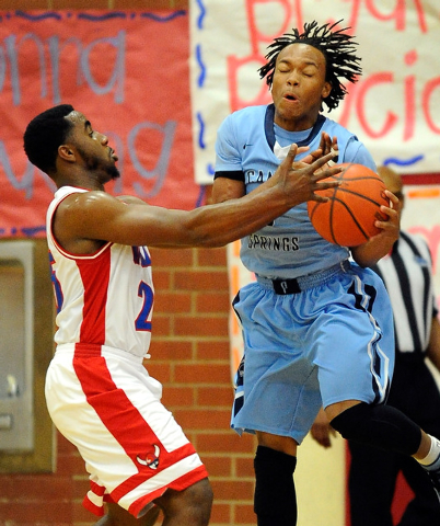 Valley’s Gerard Harden, left, and looks to grab the ball from Canyon Springs’ Ch ...