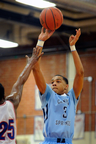 Canyon Springs’ Jordan Davis shoots over Valley’s Gerard Harden on Wednesday. Da ...