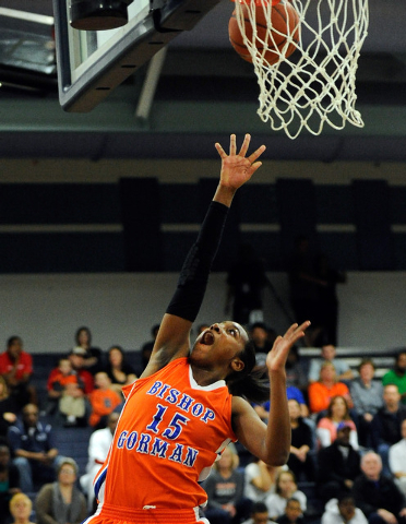 Bishop Gorman’s Maddison Washington goes in for a layup against Centennial on Thursday ...