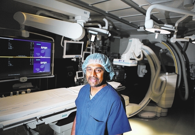 Dr. Branavan Umakanthan (cq), cardiologist, stands among state-of-the-art surgical and medical equipment in the hybrid catheter lab/operating room at Sunrise Hospital and Medical Center Friday, Ja ...