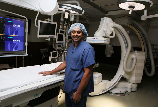 Dr. Branavan Umakanthan (cq), cardiologist, stands among state-of-the-art surgical and medical equipment in the hybrid catheter lab/operating room at Sunrise Hospital and Medical Center Friday, Ja ...