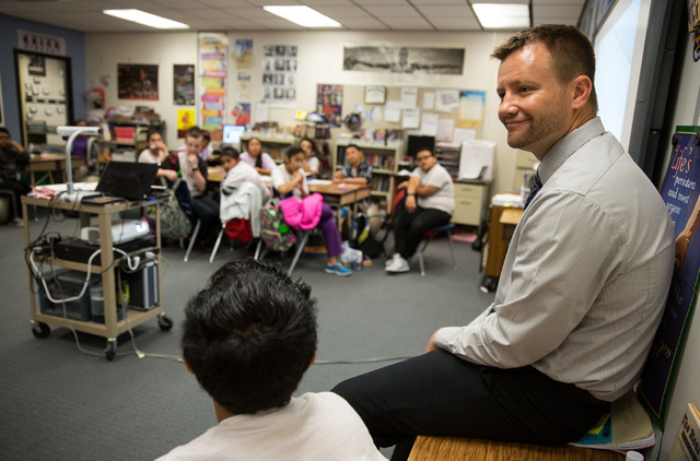 Fifth-grade teacher, Justin Brecht, right, teaches his class Friday, Feb. 21, 2014 at John F. Mendoza Elementary School. Brecht is responsible for creating Building Responsible, Independent, Compa ...