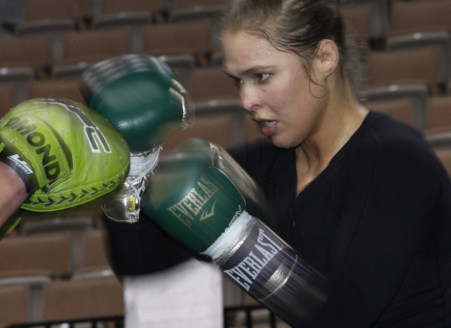 Undefeated UFC women’s bantamweight champion Ronda Rousey works out Tuesday at Mandalay Bay. The 2008 Olympic judo bronze medalist will take on undefeated 2004 wrestling silver medalist Sara McM ...
