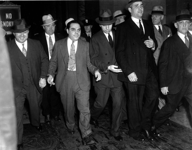 Charles "Lucky" Luciano convicted of vice charges, is leaving court on June 18, 1936 ...