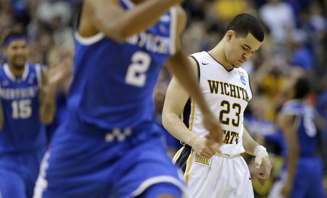 Wichita State guard Fred VanVleet (23) leaves the floor after missing a three-point attempt in the final seconds against Kentucky in the NCAA college basketball tournament Sunday in St. Louis. Ken ...