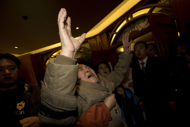 A relative of one of the Chinese passengers aboard the Malaysia Airlines, MH370 grieves after being told of the latest news in Beijing on Monday. It was the grim news that families of the missing ...