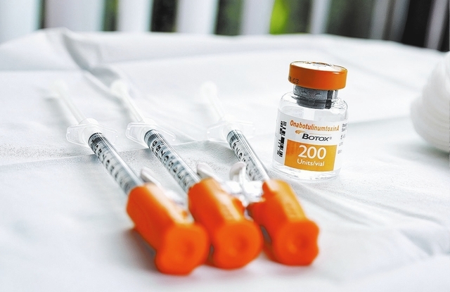 A bottle of Botox, along with the syringes used to administer it, are shown at the Nevada Neurosciences Institute at 3131 La Canada St. in Las Vegas on Thursday, March 13, 2014. The drug is being  ...