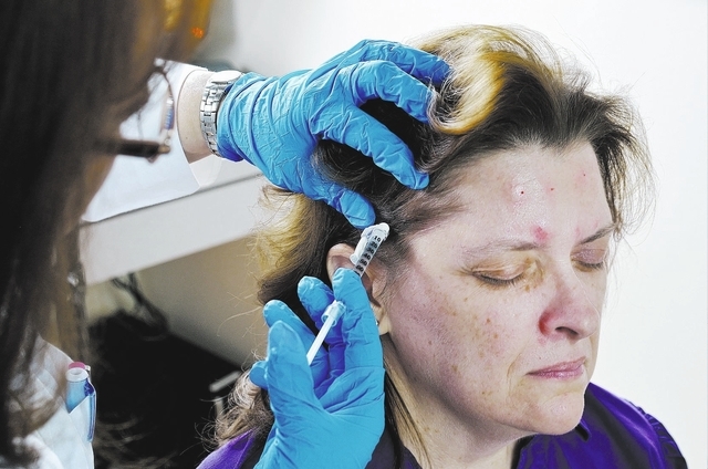 Dr. M. Gabriela Gregory, left, injects patient Nancy Buckley with Botox to help treat Buckley's migraine headaches at the Nevada Neurosciences Institute at 3131 La Canada St. in Las Vegas on Thurs ...
