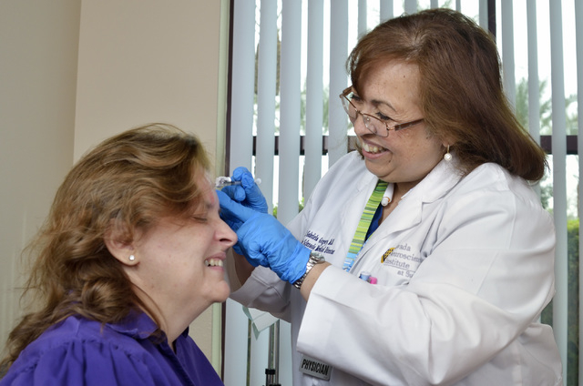 Dr. M. Gabriela Gregory, right, injects patient Nancy Buckley with Botox to help treat Buckley's migraine headaches at the Nevada Neurosciences Institute at 3131 La Canada St. in Las Vegas on Thur ...