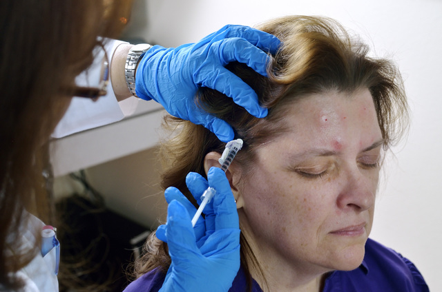 Dr. M. Gabriela Gregory, left, injects patient Nancy Buckley with Botox to help treat Buckley's migraine headaches at the Nevada Neurosciences Institute at 3131 La Canada St. in Las Vegas on Thurs ...