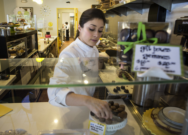 Tiffany Jones, baker and owner of Peridot Sweets, 6475 S. Rainbow Boulevard, plates truffles on Friday, March 14, 2014.  
(Jeff Scheid/Las Vegas Review-Journal)