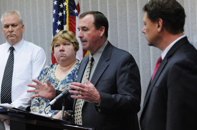 Las Vegas police Capt. Brett Primas, second from right, speaks during a press conference with Clark County School District staff, from left, Police Chief James Ketsaa, Trustee Deanna L. Wright and ...