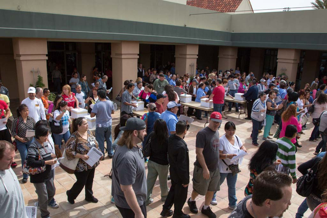 Culinary Workers Union, Local 226 members flood from the meeting hall into the courtyard to cast their ballots at the East Las Vegas Community Center on Thursday, March 27, 2014. Both culinary wor ...