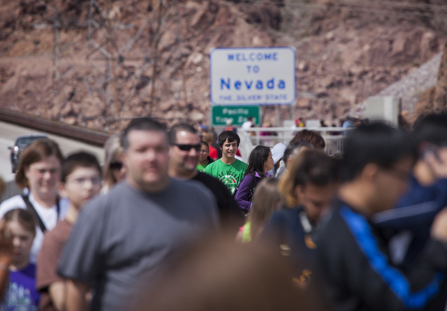 People walk on top of the OՃallaghan-Tillman Memorial Bridge on Thursday, March 20, 2014. The world's highest concrete arch bridge was open in 2010.(Jeff Scheid/Las Vegas Review-Journal)