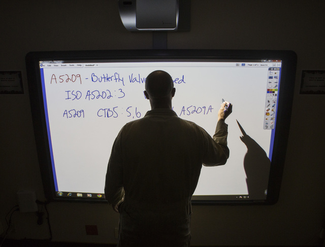 Intern Cecil Levy during a system electrician apprentice class at Hoover Dam on Thursday, March 20, 2014.Almost two-fifths of the workforce at the federal facility is expected to retire within th ...