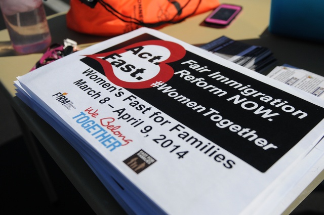 Signs in support of an immigration reform are seen during a fasting event outside of the office of U.S. Rep. Joe Heck, R-Nev., in protest of the Congress not taking action on a comprehensive immig ...