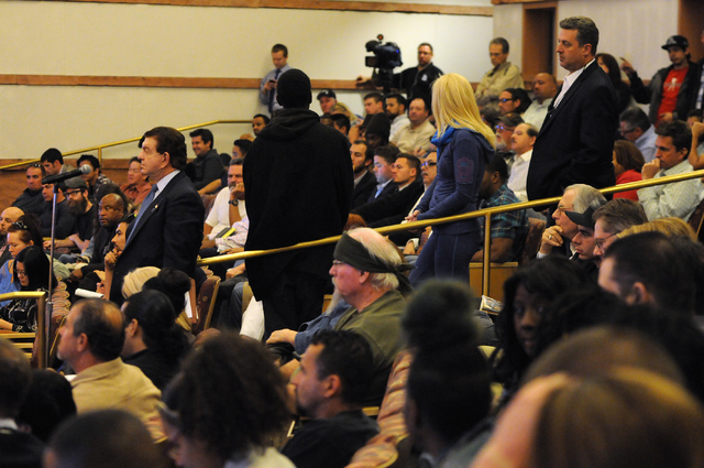 Attendees line up to ask a question during a public meeting on a new ordinance that would allow dispensaries for medical marijuana in Clark County at the Clark County Government Center in Las Vega ...