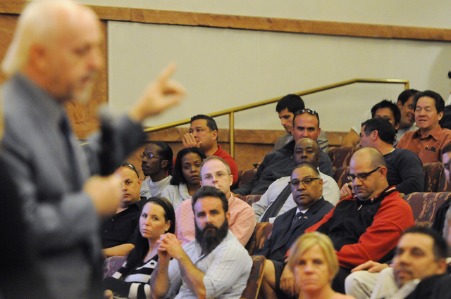 Attendees listen to Michael McAuliffe, political outreach director of marijuana patient advocate group WECAN, as he speaks in favor of a new ordinance that would allow dispensaries for medical mar ...