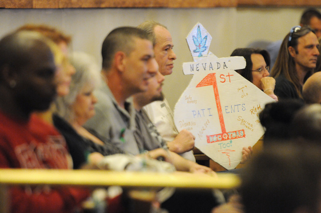 Attendees listen during a public meeting on a new ordinance that would allow dispensaries for medical marijuana in Clark County at the Clark County Government Center in Las Vegas Wednesday, March ...