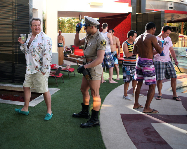 Cam (Eric Stonestreet), left, attends a pool party at Moorea Beach Club at Mandalay Bay in the "Las Vegas" episode of "Modern Family." (Ronda Churchill/ABC)