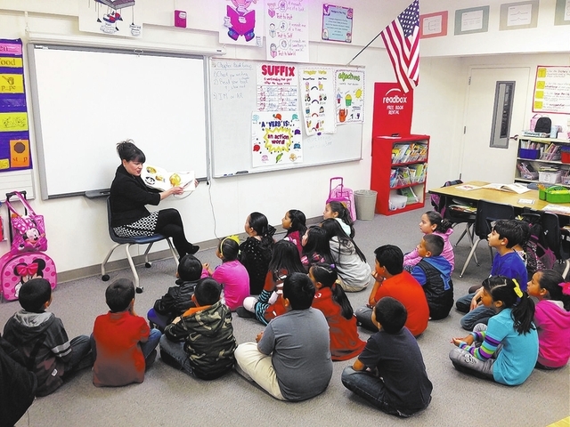 Special to View
Brooke Thompson with Bank of America reads to a class March 4 at Fay Herron Elementary School, 2421 Kenneth Road, during Nevada Reading Week.