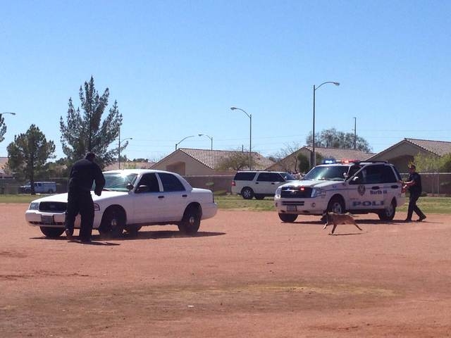 Police officers participate in a canine demonstration at Elizondo Elementary School on Wednesday, March 12, 2014 in North Las Vegas. The school was dedicated in 1998 and named in honor of Officer ...