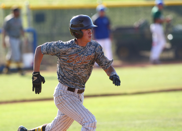 Bonanza's Micah Higa (17) runs for first base against Green Valley on Friday. (Chase Stevens/Las Vegas Review-Journal)