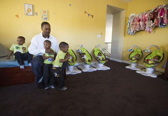 Deon Derrico with eight of his nine children at their home in North Las Vegas on Monday, March 24, 2014. His wife Evonne Derrico gave birth to quintuplets on Sept. 6.(Jeff Scheid/Las Vegas Review- ...