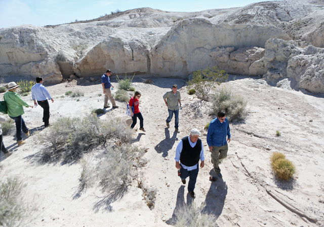 Rep. Rob Bishop, R-Utah, front center, walks with Ryann Juden (cq), right, executive government affairs liaison for the City of North Las Vegas, during a tour of a portion of the proposed Tule Spr ...
