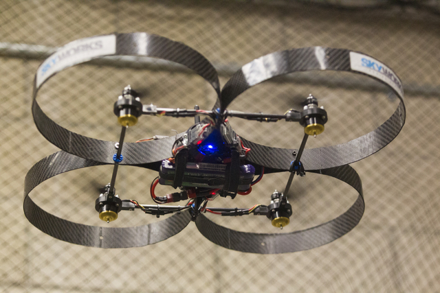 An unmanned aerial system, otherwise known as a drone, is controlled by mechanical engineering senior Greg Friesmuth in a lab at the Thomas Beam Engineering Complex on the campus of the University ...