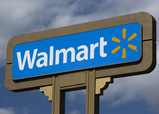 Wal-Mart has rolled out an online tool called “Savings Catcher” that allows shoppers to compare its prices on 80,000 food and household products to those of its competitors. (AP Photo/Damian D ...