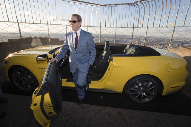 Bill Ford, Ford Motor Company's executive chairman, stands with the all-new 2015 Mustang convertible as it's introduced on the 86th floor observation deck of the Empire State Building during the N ...