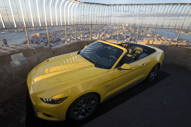 Ford Motor Co. introduces the all-new 2015 Mustang convertible on the 86th floor observation deck of the Empire State Building during the New York International Auto Show, Wednesday, April 16, 201 ...
