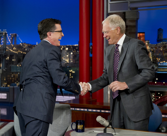 On May 3, 2012 Stephen Colbert, left, host of the "Colbert Report" on the Comedy Central Network, has a laugh on stage with host David Letterman on the set of the "Late Show" with David Letterman, ...