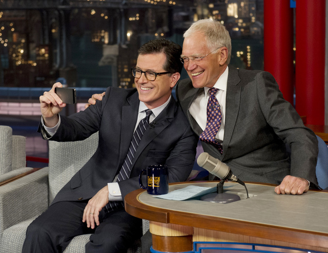 On May 3, 2012 Stephen Colbert, left, host of the "Colbert Report" on the Comedy Central Network, takes a 'selfie' with host David Letterman on the set of the "Late Show" with David Letterman, in  ...
