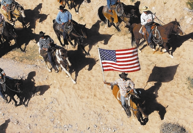 The Bundy family and their supporters fly the American flag as their cattle were released by the BLM back onto public land outside of Bunkerville on April 12, 2014. (Jason Bean/Las Vegas Review-Jo ...