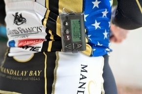 Triathlete  wears a glucose monitor and an insulin pump to check and control his blood glucose levels during a race.
