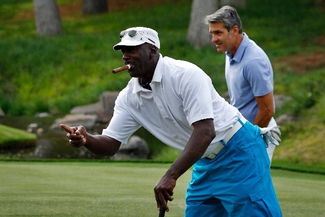 Michael Jordan celebrates after sinking a putt during last year's Michael Jordan Celebrity Invitational at Shadow Creek Golf Club.  (File photo)