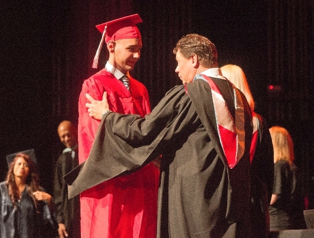 Clark County School District Superintendent Pat Skorkowsky congratulates Western High School student Angel Peraza-Lezcano ,19, during autumn graduation at the Theater of the Las Vegas Academy of I ...