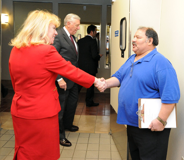 Nevada congressional candidate Erin Bilbray shakes hands with Steward Supervisor Geardo Quiralte as she tours the Culinary Training Academy in Las Vegas, Monday, April 21, 2014. U.S. House minorit ...