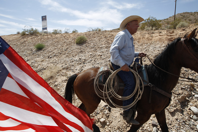 Rancher Cliven Bundy rides a horse at a protest area near Bunkerville, Nev. Wednesday, April 16, 2014.  (John Locher/Las Vegas Review-Journal)