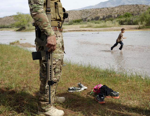 Anthony Scalzo stands by the Virgin River during a rally in support of Cliven Bundy near Bunkerville, Nev. Friday, April 18, 2014. (John Locher/Las Vegas Review-Journal)