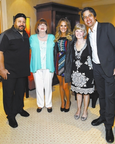 Kevin James (left) most recently performed with Ray Romano (right) April 4 at The Mirage, where he was greeted backstage by Carrie Underwood (middle), her mom Carol (on her daughter's left arm) an ...