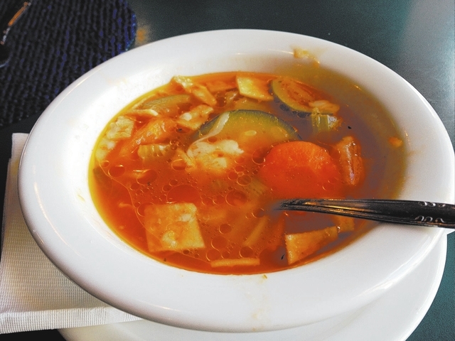 The soupa de tortilla, or tortilla soup, comes with an abundance of vegetables, tortilla strips and cheese. (Sandy Lopez/View)