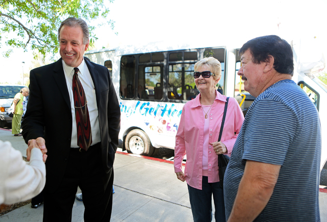 North Las Vegas Mayor John Lee, left, speaks to people during the "Get Moving! Get Healthy!" bus unveiling at North Las Vegas Neighborhood Recreation Center on Wednesday, April 16, 2014. Eudora an ...