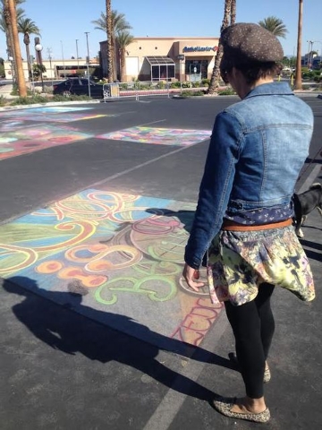 Nikki J. Sands, a featured artist at Arts, Eats & Beats, contemplates chalk art at the Village Square event, March 30. The open-air shopping center at 9400 W. Sahara Ave. co-hosted the event with ...